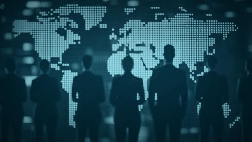 people looking at large world map
