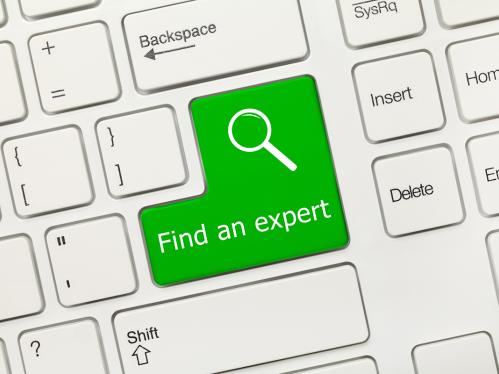 White conceptual keyboard - Find an expert (green key)